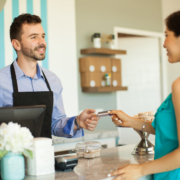 woman-using-gift-card-at-small-cafe