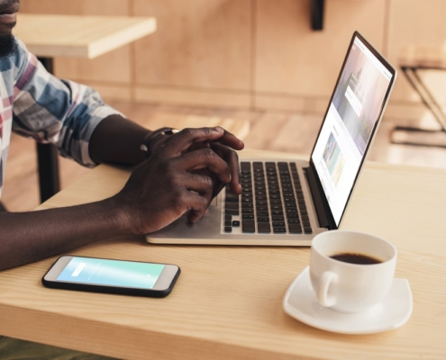 african-american-male-looking-at-laptop