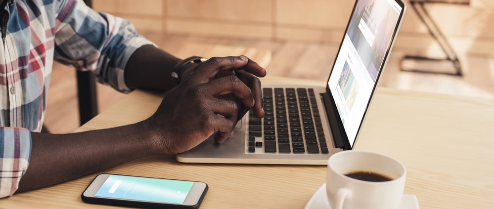 african-american-male-looking-at-laptop