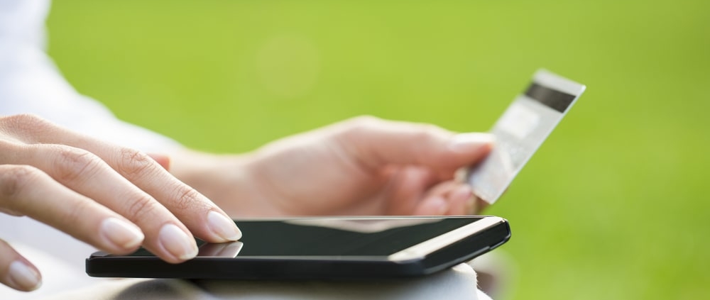 person-using-gift-card-on-mobile-device