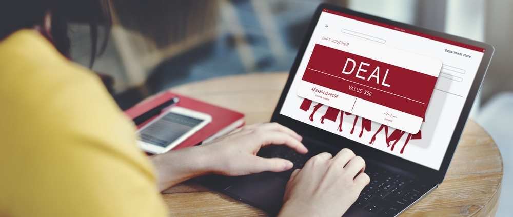 woman-looking-at-gift-card-incentive-on-laptop