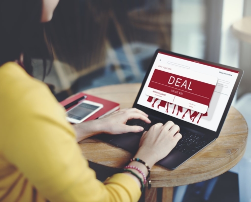 woman-looking-at-gift-card-incentive-on-laptop