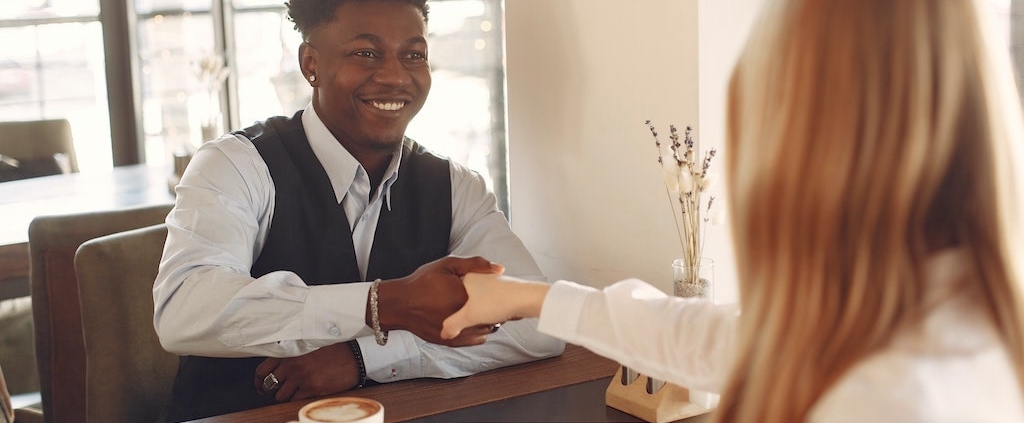 two-business-professionals-shaking-hands