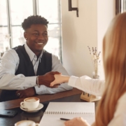 two-business-professionals-shaking-hands