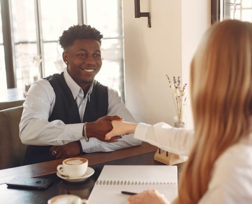 two-business-professionals-shaking-hands