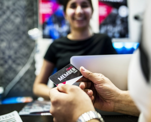Person looking at gift card before paying