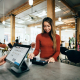 Woman paying with Gift Card at Salon