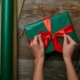 Tying bow on gift